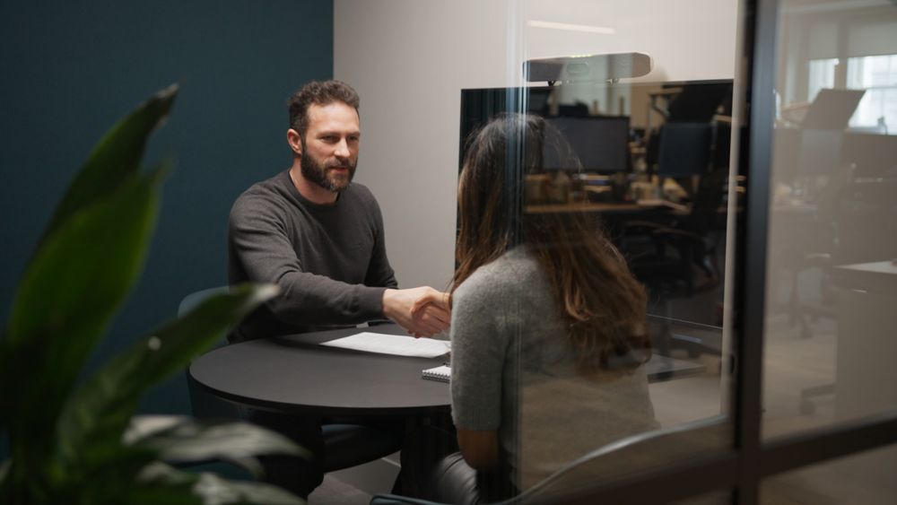 A recruiter interviewing a candidate.